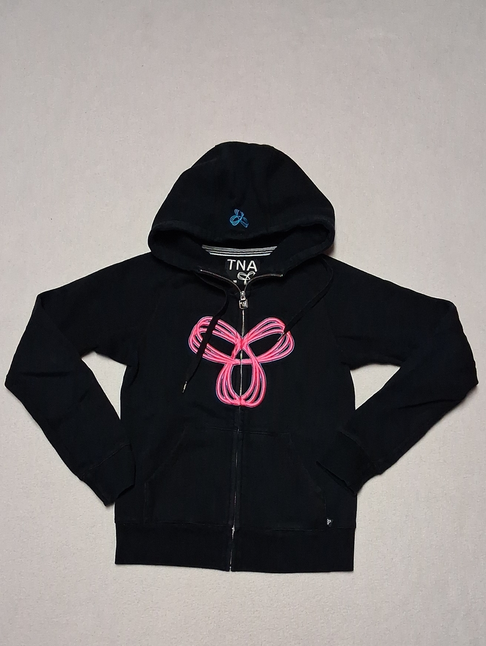 TNA Black Zip-Up Hoodie with Pink Loop Graphic